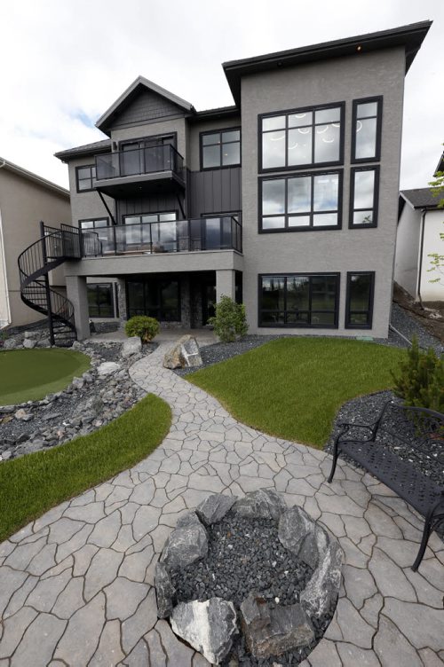 Homes. House at 124 Lake Bend Road, Artista Homes sales rep is Phil Amero.  The landscaped back yard.Todd Lewys story Wayne Glowacki / Winnipeg Free Press June 15 2015