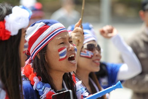 Thailand fans get into the spirit as they approach the entrance to the stadium for the FIFA Women's World Cup match between Germany and Thailand Monday afternoon in Winnipeg.  150615 June 15, 2015 MIKE DEAL / WINNIPEG FREE PRESS