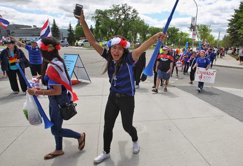 Thailand fans get into the spirit as they approach the entrance to the stadium for the FIFA Women's World Cup match between Germany and Thailand Monday afternoon in Winnipeg.  150615 June 15, 2015 MIKE DEAL / WINNIPEG FREE PRESS