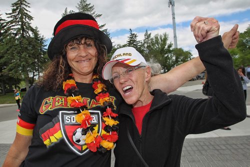 German fans Andrea Willcott and Wendy Sterritt (right) get into the spirit as they approach the entrance to the stadium for the FIFA Women's World Cup match between Germany and Thailand Monday afternoon in Winnipeg.  150615 June 15, 2015 MIKE DEAL / WINNIPEG FREE PRESS