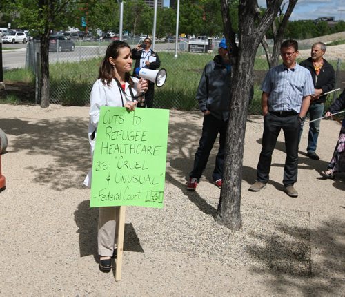 Rally for refugee health - Physicians, nurses, community health workers, and other health professionals along with students and supportive Canadians  in more than 20 cities across the country are rallying for refugee health care funding. Photo at the CMHR by the Mahatma Gandhi Statue where they paused to say a few words. BORIS MINKEVICH/WINNIPEG FREE PRESS June 15, 2015