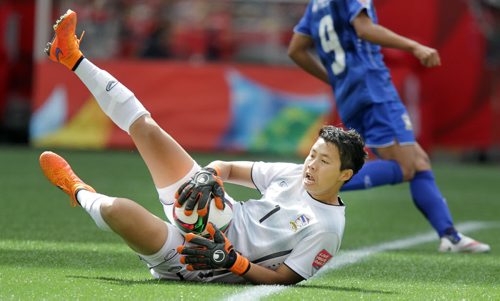 Thailand's netminder Waraporn Boonsing makes a save on one of the many German opportunities Monday at Investor's Field in FIFA Action. See Story. June 15, 2015 - (Phil Hossack / Winnipeg Free Press)