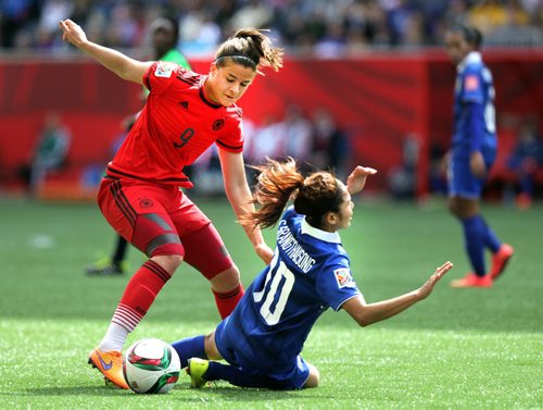 Germany's #9 Lena Lotzen overpowers Thailand's#10 Sunisa Spangthaisong Monday at Investor's Field in FIFA Action. See Story. June 15, 2015 - (Phil Hossack / Winnipeg Free Press)