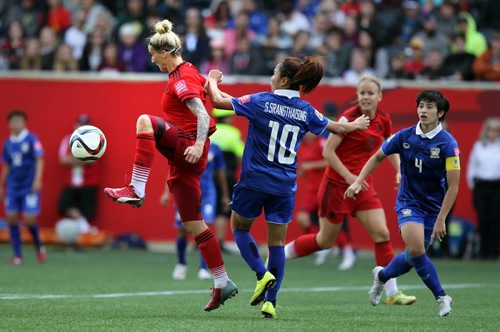 Germany's #11 Ania Mittag takes control from Thailand's # 10Sunisa Spanthaisong Monday at Investor's Field in FIFA Action. See Story. June 15, 2015 - (Phil Hossack / Winnipeg Free Press)