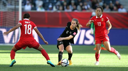 New Zealand's #6 Rebekah Stott looks for room between China's #18Peng Han and #13 Jiali Tang in FIFA action at Investor's FIeld in WInnipeg Monday. June 15, 2015 - (Phil Hossack / Winnipeg Free Press)