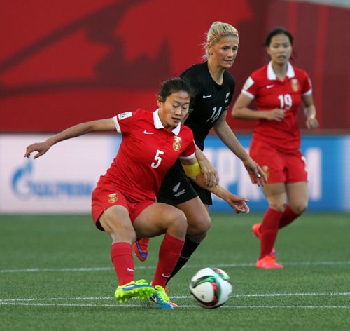 China's #5 Haiyan Wu takes control from New Zealand's #14 Katie Bowen Monday at Investor's FIeld in FIFA action. See Story. June 15, 2015 - (Phil Hossack / Winnipeg Free Press)