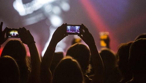 Fans take photos as Shania Twain performs at the MTS Centre in Winnipeg on Monday, June 15, 2015.  Mikaela MacKenzie / Winnipeg Free Press