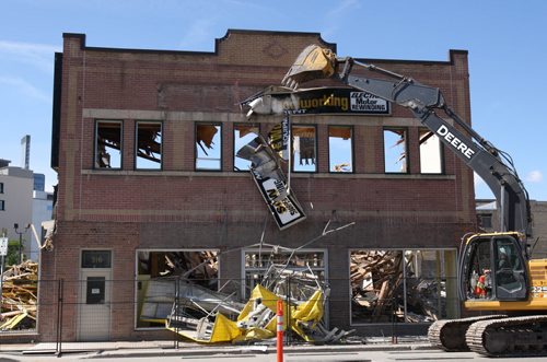 The Lukes Machinery building  at  316 Notre Dame Ave had its last gasp today as demolition crews tore it down to make way for a new surface parking lot for Calvary Temple  - Standup Photo- June 16, 2015   (JOE BRYKSA / WINNIPEG FREE PRESS)