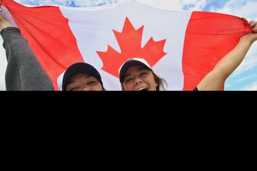 "It's been a blast!" Sisters, Sydney (left), 20, and Hayley White, 18, from Kansas City, MO, have been in Winnipeg for all the FIFA matches and loved every minute of it.  150616 June 16, 2015 MIKE DEAL / WINNIPEG FREE PRESS
