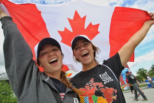 "It's been a blast!" Sisters, Sydney (left), 20, and Hayley White, 18, from Kansas City, MO, have been in Winnipeg for all the FIFA matches and loved every minute of it.  150616 June 16, 2015 MIKE DEAL / WINNIPEG FREE PRESS
