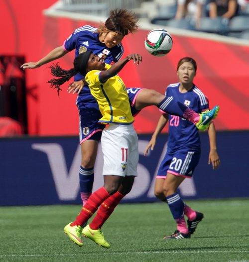 Equador's #11 Monica Quinteros and Japan's #23 Kana Kitahara collide heading the ball Tuesday afternoon at Investor's FIeld in FIFA action. #20 Yuri Kawamura looks on. See story.June 16, 2015 - (Phil Hossack / Winnipeg Free Press)