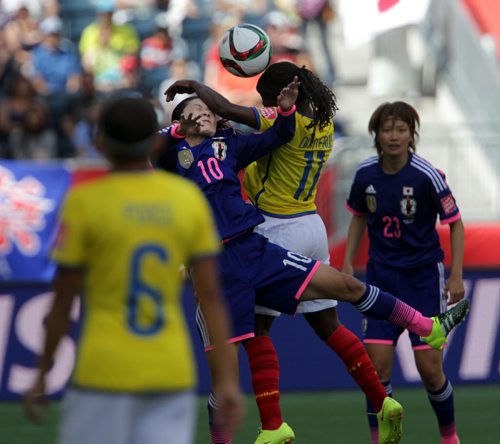 Japan's  #10 Homare Sawa collides with Equador's #11 Monica Quinteros Tuesday afternoon at the Investor's Stadium in FIFA action. See story. June 16, 2015 - (Phil Hossack / Winnipeg Free Press)