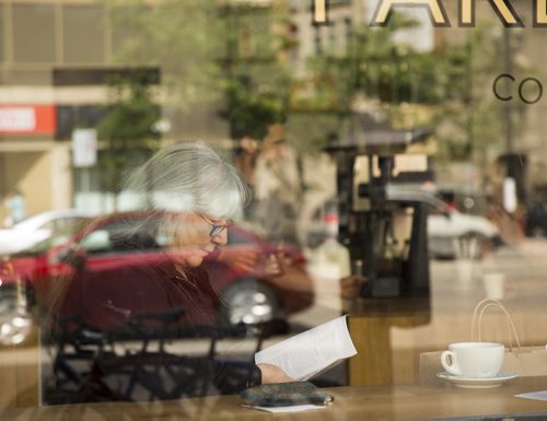 Diane Lonergan waits for a friend in a cafe in the exchange district on Tuesday, June 16, 2015. Mikaela MacKenzie / Winnipeg Free Press