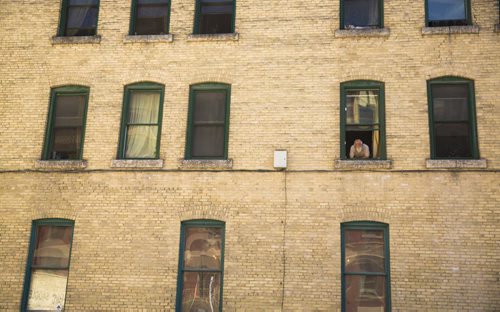 Thor Steinthorson looks out a window from a building in the exchange district on Tuesday, June 16, 2015. Mikaela MacKenzie / Winnipeg Free Press