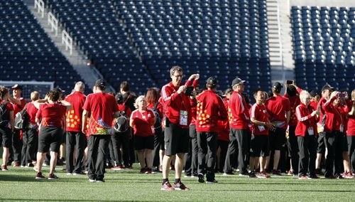 FIFA Volunteers flooded the field after the fans and athletes cleared out Tuesday giving them a chance to experience the stadium from a new perspective and take q few photos. June 16, 2016 - (Phil Hossack / Winnipeg Free Press)