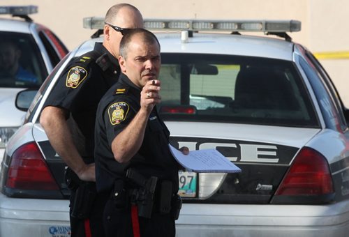 Police have tapped off a large area around Legends Bar & Grill near the Courts of St James apartments at Portage Ave and Woodhaven Blvd after reports of shots fired at 5 AM in the area - Breaking News- June 17, 2015   (JOE BRYKSA / WINNIPEG FREE PRESS)