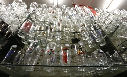 Sunday, This City.  The location is The Rec Room, 377 Henderson Hwy (lower level),  the owners are Glenn and Vera Maskiw. Some of the glassware on display.  Dave Sanderson story.   Wayne Glowacki / Winnipeg Free Press June 17  2015
