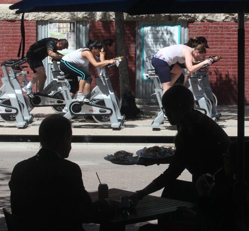 Pan am boxing outdoor spinner class on Arthur St in Winnipegs Exchange District- For now they are doing noon out door classes and are considering 530-630 pm next week- Visit Panboxing.com for details-   Standup Photo- June 18, 2015   (JOE BRYKSA / WINNIPEG FREE PRESS)