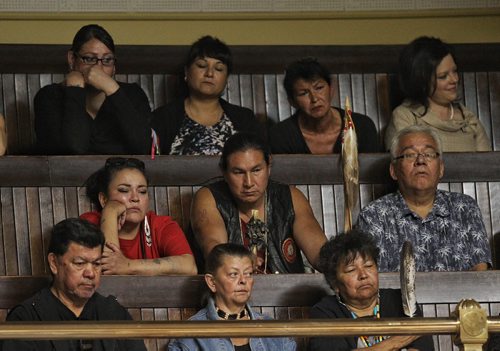 Marlene Orgeron (back row second from left), adoptee, '60s Scoop survivor listens to Premier Greg Selinger offers an apology from the people of Manitoba during question period in the Manitoba Legislative Building Thursday.  150618 June 18, 2015 MIKE DEAL / WINNIPEG FREE PRESS