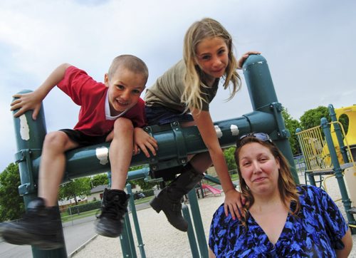 William Carter, 8, his sister, Kaitlyn, 10, and mom, Shannon are ready to ship off to summer camp in late August. (Jessica Botelho-Urbanski / Winnipeg Free Press)