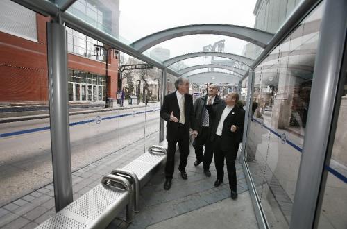 John Woods / Winnipeg Free Press / November 16/07- 071116  - Steve Ashton, Minister of Intergovernmental Affairs, city councillor Russ Wyatt, and Mayor Sam Katz take a walk through one of the new heated bus shelters on Graham Avenue in downtown Winnipeg Friday November 16/07.   The three levels of government announced at a press conference today that they have partnered to move Winnipeg transit improvements forward with the introduction of its Transit Improvement Program.