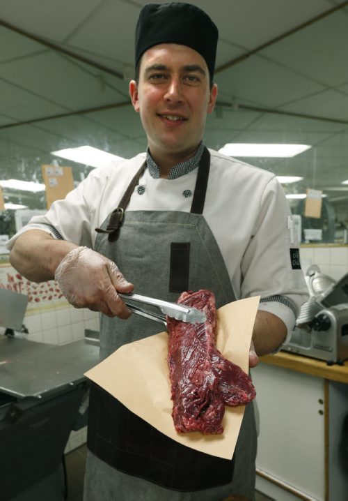 Butcher Dallas Black with a Hanger steak at DeLuca's on Portage Ave.  Bart Kives  story.  Wayne Glowacki / Winnipeg Free Press June 19  2015