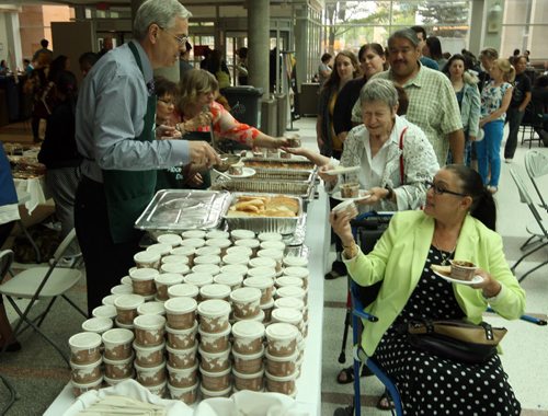 The University of Manitoba hosts National Aboriginal Day celebrations at the Bannatyne campus. Left - Health Science Centre COO Dana Erickson serves up some grub to hundreds of people. BORIS MINKEVICH/WINNIPEG FREE PRESS June 19, 2015