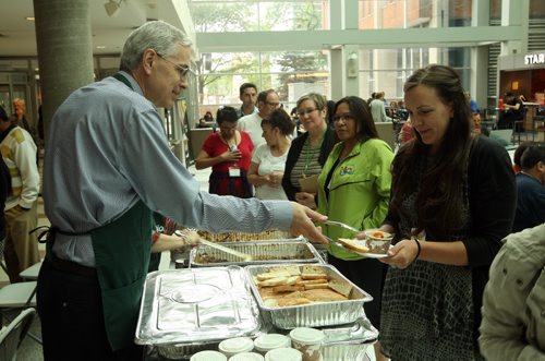 The University of Manitoba hosts National Aboriginal Day celebrations at the Bannatyne campus. Left - Health Science Centre COO Dana Erickson serves up some grub to hundreds of people. BORIS MINKEVICH/WINNIPEG FREE PRESS June 19, 2015