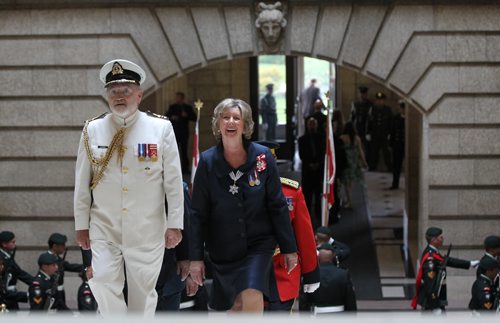 The honourable Janice Filmon, newly appointed as the Lieutenant-Governor of Manitoba, beams with a glowing smile as she makes her way up the grand staircase of the Manitoba Legislature Building after inspecting the guards during ceremony in Friday.      June 19, 2015 Ruth Bonneville / Winnipeg Free Press