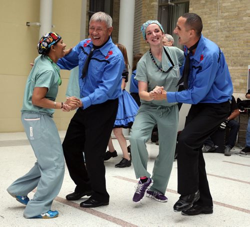 The University of Manitoba hosts National Aboriginal Day celebrations at the Bannatyne campus. The Norman Chief memorial dancers grabbed some HSC workers and danced a jig. (Left to right) Nursing assistant Vijayani Vithanage and dancer Sonny Delaronde, and Nursing assistant Christine Bosko and Kevin Chief dance. BORIS MINKEVICH/WINNIPEG FREE PRESS June 19, 2015