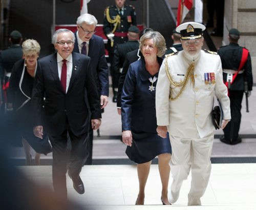 Flanked by her aid deCamp and her husband Gary, soon to be Lt Governor Janice Filmon ascends the Legislatures Grand Staircase towards her swearing in ceremony Friday. See story. June 19, 2015 - (Phil Hossack / Winnipeg Free Press)