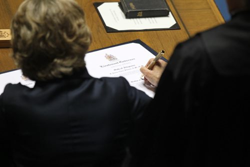 The honourable Janice Filmon, newly appointed as the Lieutenant-Governor of Manitoba, signs the legal documents during her swearing in   Friday at the Manitoba Legislature Building      June 19, 2015 Ruth Bonneville / Winnipeg Free Press
