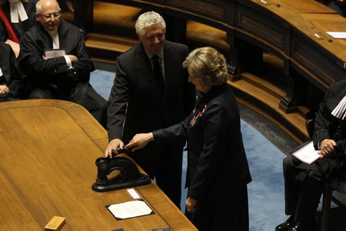 The honourable Janice Filmon, newly appointed as the Lieutenant-Governor of Manitoba, presses down on the formal seal  during her swearing in   Friday at the Manitoba Legislature Building      June 19, 2015 Ruth Bonneville / Winnipeg Free Press