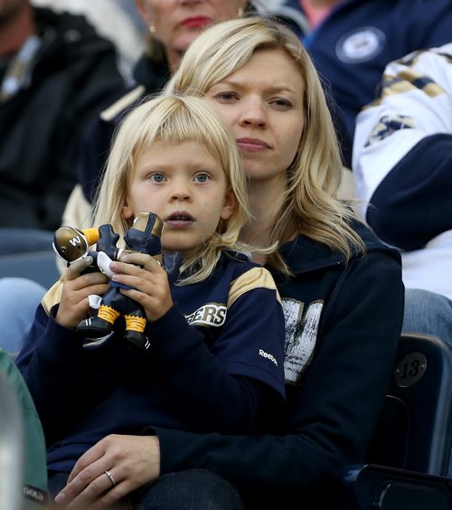 A young Winnipeg Blue Bombers' fan watches the team play the Hamilton Tiger-Cats' during preseason CFL action, Friday, June 19, 2015. (TREVOR HAGAN/WINNIPEG FREE PRESS)