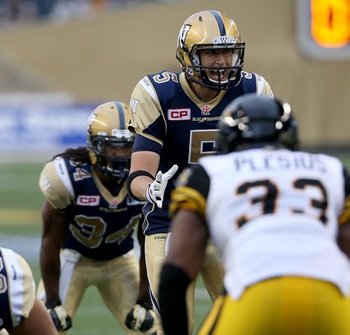Winnipeg Blue Bombers' quarterback Drew Willy (5) instructs his players before the ball is snapped against the Hamilton Tiger-Cats' during preseason CFL action, Friday, June 19, 2015. (TREVOR HAGAN/WINNIPEG FREE PRESS)