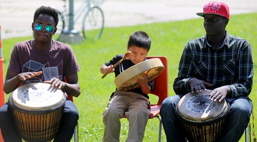 Matthew Ndaya, Alvin Deegan Jr. and Jeremie Kalimba all playing together at the Bread and Bannock Festival near the Community Oven at Norquay Community Centre, Saturday, June 20, 2015. An organizer said the focus of the event was about connecting First Nations people with new immigrants in the area. (TREVOR HAGAN/WINNIPEG FREE PRESS)