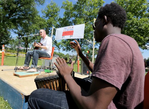 Nathan Rogers and Matthew Ndaya playing together at the Bread and Bannock Festival near the Community Oven at Norquay Community Centre, Saturday, June 20, 2015. (TREVOR HAGAN/WINNIPEG FREE PRESS)