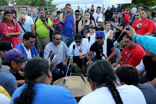 The Brown Bear Drum Group, made up of members from many communities, but all residing in St.Norbert, playing at The Forks, on Aboriginal Day, Saturday, June 20, 2015. (TREVOR HAGAN/WINNIPEG FREE PRESS)
