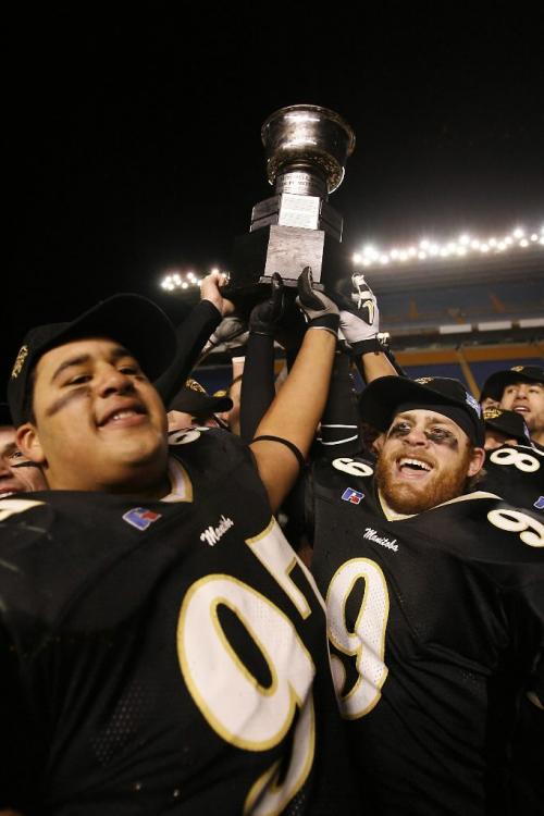 John Woods / Winnipeg Free Press / November 17/07- 071117  -  University of Manitoba Bisons Eddie Steele (97) and Erik Gustafson (9)  celebrate a 52-20 win over the Western Ontario Mustangs in the Mitchell Bowl in Winnipeg Saturday Nov 17/07.