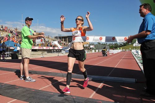 Heather Magill from Grand Forks wins the woman's full marathon with a time of 2:54:24 during the Manitoba Marathon Sunday morning.  150621 June 21, 2015 MIKE DEAL / WINNIPEG FREE PRESS