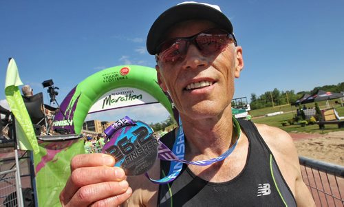 Larry Ness from Campbell River (3:08:15) finishes first in the 60-64 age category of the Manitoba Full Marathon Sunday.  150621 June 21, 2015 MIKE DEAL / WINNIPEG FREE PRESS