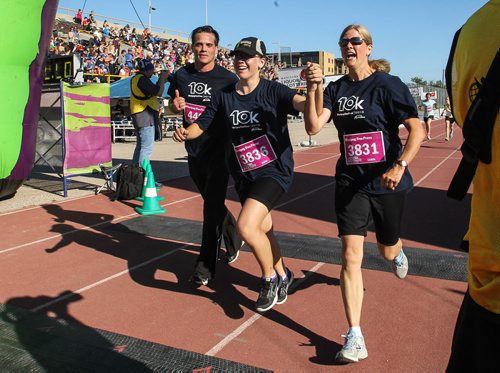 Participants in the Manitoba Marathon approach the finish line inside the University of Manitoba stadium Sunday morning. 150621 - Sunday, June 21, 2015 -  MIKE DEAL / WINNIPEG FREE PRESS