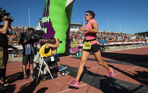 Participants in the Manitoba Marathon approach the finish line inside the University of Manitoba stadium Sunday morning. 150621 - Sunday, June 21, 2015 -  MIKE DEAL / WINNIPEG FREE PRESS