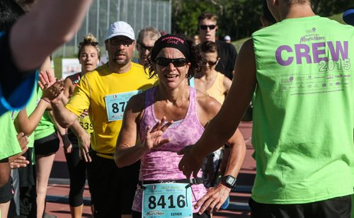 Participants in the Manitoba Marathon approach the finish line inside the University of Manitoba stadium Sunday morning. 150621 - Sunday, June 21, 2015 -  MIKE DEAL / WINNIPEG FREE PRESS