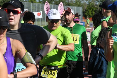 Participants in the Manitoba Marathon approach the finish line inside the University of Manitoba stadium Sunday morning. 150621 - Sunday, June 21, 2015 -  MIKE DEAL / WINNIPEG FREE PRESS