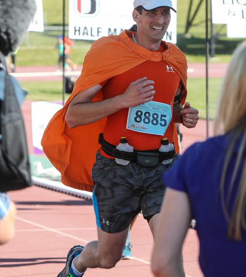 Participants in the Manitoba Marathon approach the finish line inside the University of Manitoba stadium Sunday morning. 150621 - Sunday, June 21, 2015 -  MIKE DEAL / WINNIPEG FREE PRESS