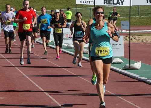 Participants in the Manitoba Marathon approach the finish line inside the University of Manitoba stadium Sunday morning. 150621 - Sunday, June 21, 2015 -  MIKE DEAL / WINNIPEG FREE PRESS