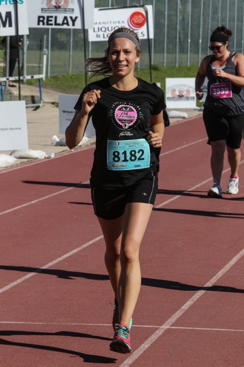 Participants in the Manitoba Marathon approach the finish line inside the University of Manitoba stadium Sunday morning. 150621 - Sunday, June 21, 2015 -  MIKE DEAL / WINNIPEG FREE PRESS