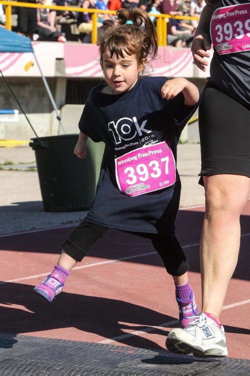 Participants in the Manitoba Marathon approach the finish line inside the University of Manitoba stadium Sunday morning. 150621 - Sunday, June 21, 2015 -  MIKE DEAL / WINNIPEG FREE PRESS