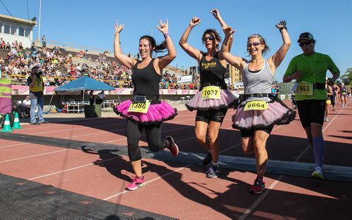 Participants in the Manitoba Marathon approach the finish line inside the University of Manitoba stadium Sunday morning. 150621 - Sunday, June 21, 2015 -  MIKE DEAL / WINNIPEG FREE PRESS